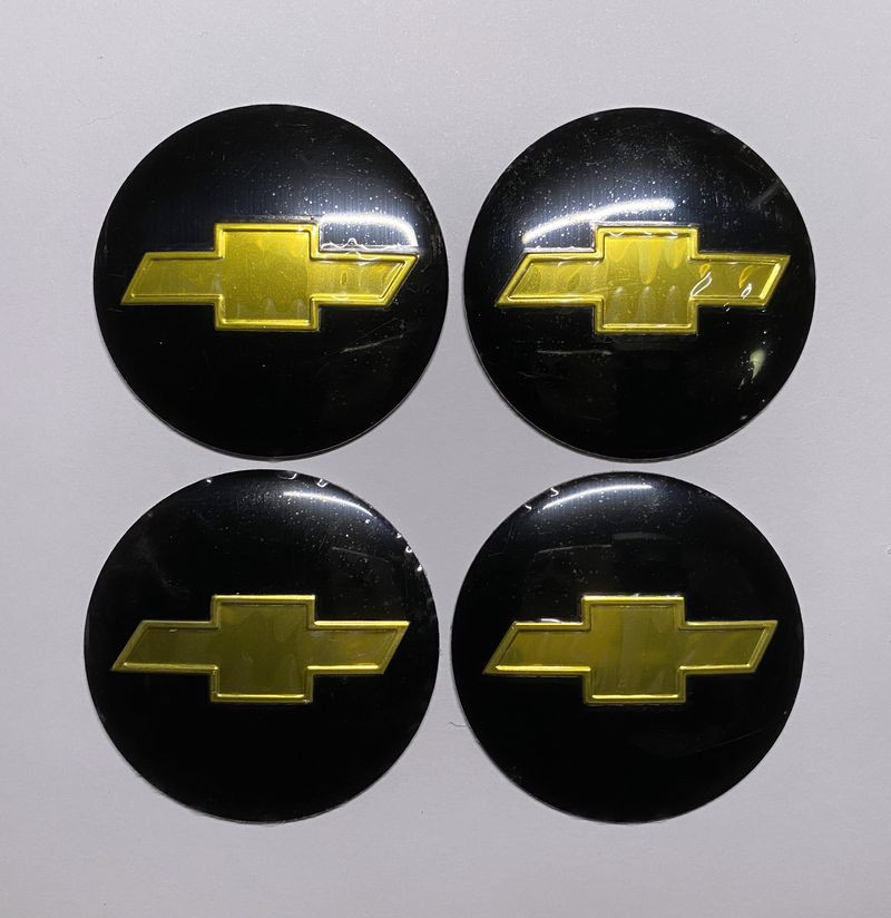 Этикетки на диски (метал)  диам. 56,5мм.  "CHEVROLET" черный  (4 шт.)