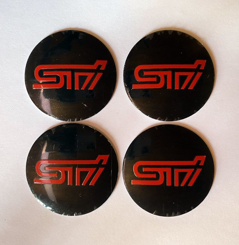 Этикетки на диски (метал)  диам. 56,5мм.  "STI" черный  (4 шт.)