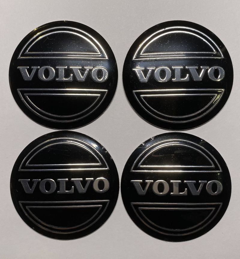 Этикетки на диски (метал)  диам. 56,5мм.  "VOLVO" черный  (4 шт.)